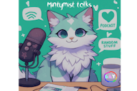 a cat sitting in front of a microphone